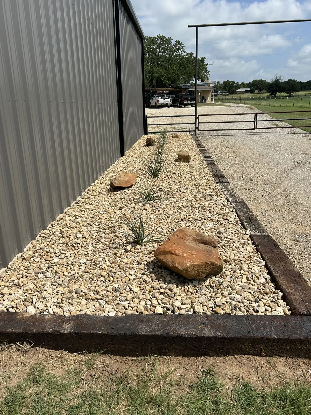 Landscape project with rock beds and boulders in Peaster TX