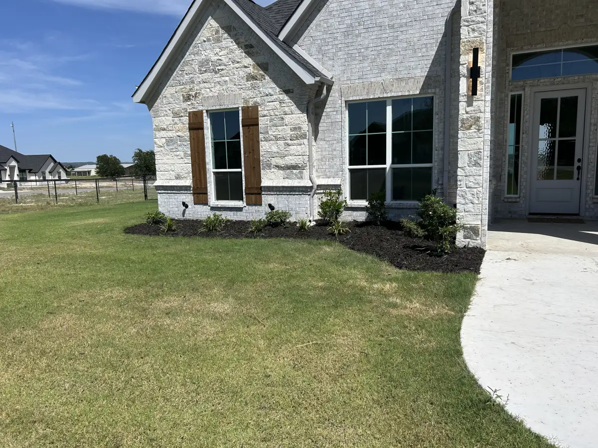Professional landscape design project in Weatherford TX with mulch beds and plantings