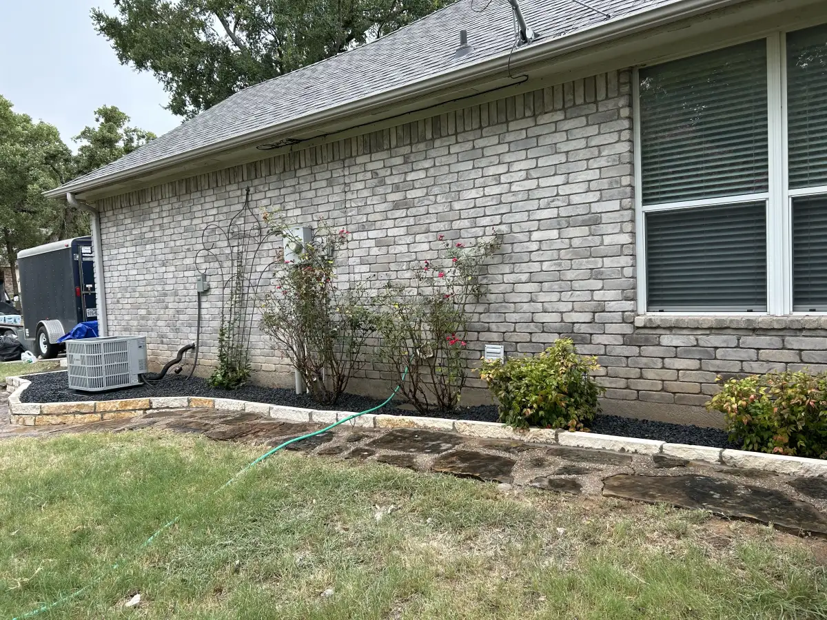 Custom flower bed installation with colorful plantings in Weatherford TX