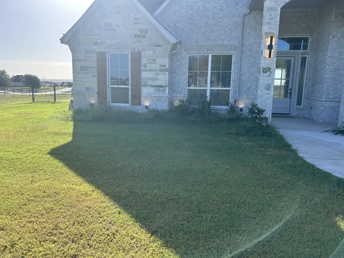 Fresh sod installation and planting beds at a Weatherford TX property